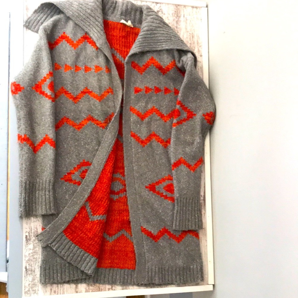 Gray and orange open cardigan sweater.
